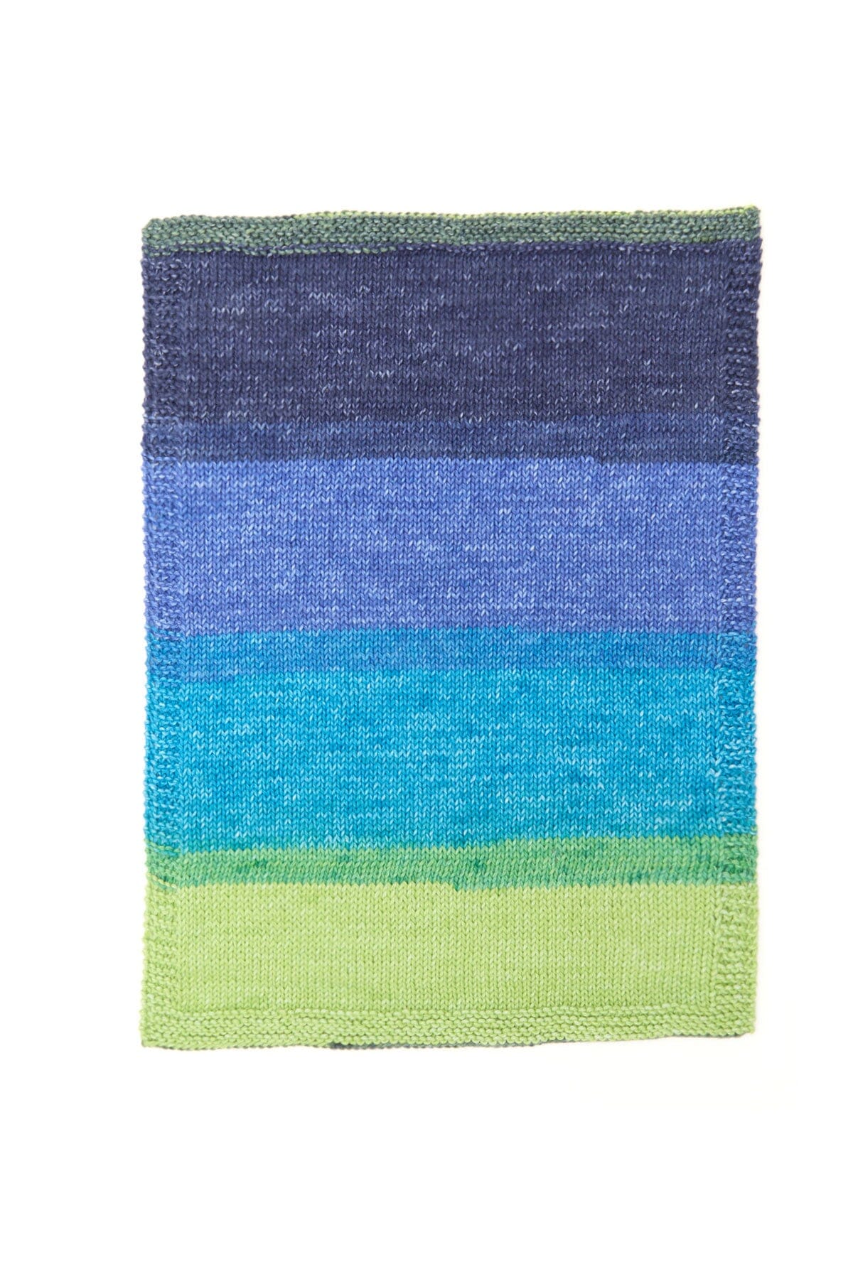 Rectangular knitted swatch with gradient colors from blue to green on a white background