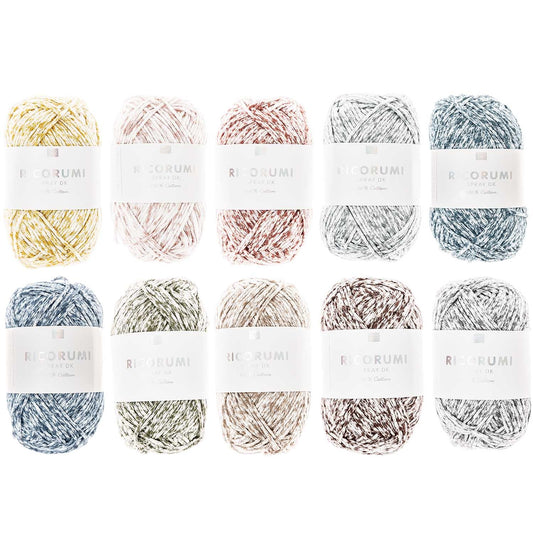 A collection of Ricorumi Spray DK yarn skeins in various colors, arranged in a grid pattern.