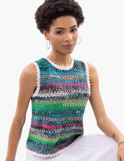 Woman wearing a colorful striped sleeveless crochet top against a white background