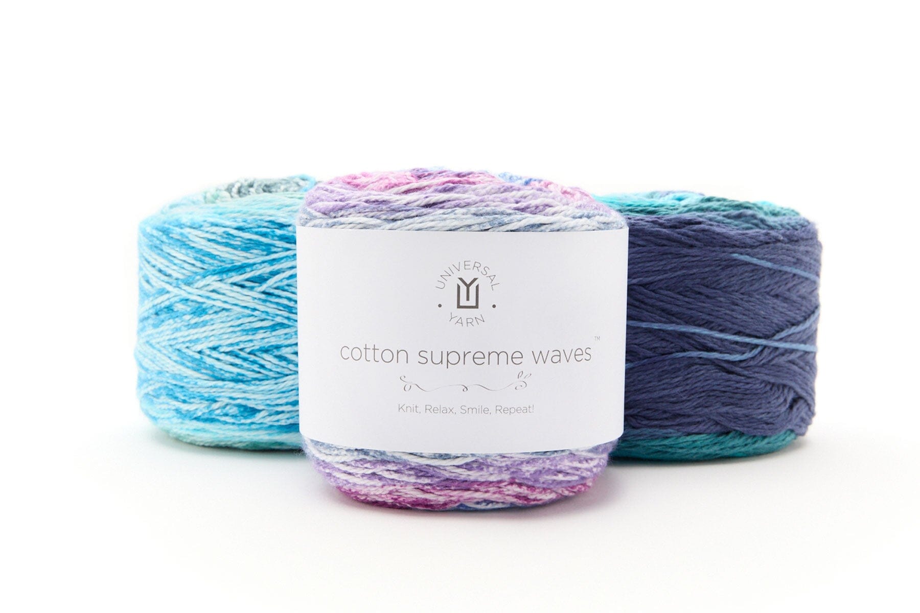 Three skeins of yarn with a label on a white background