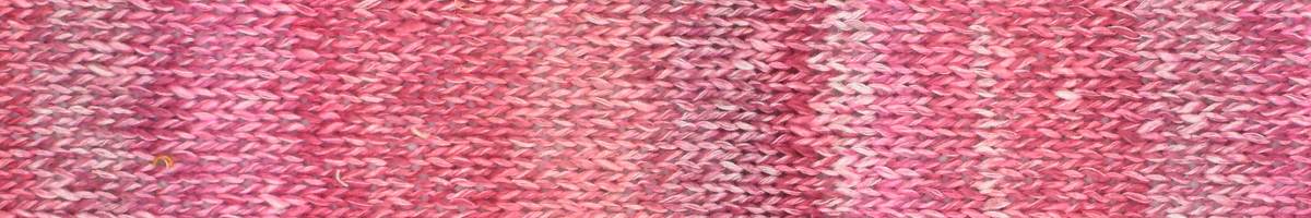 Close-up of pink yarn swatch with gradient colors