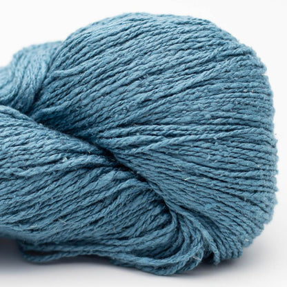 Blue skein of yarn on a white background