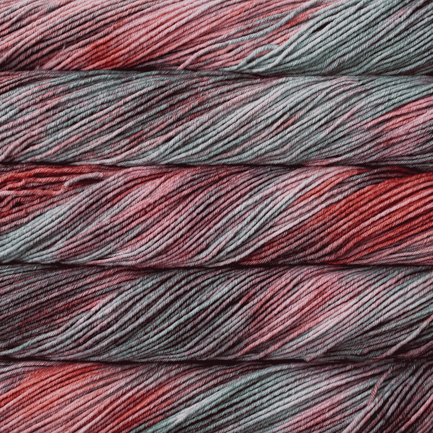 Close-up of red and gray yarn skeins